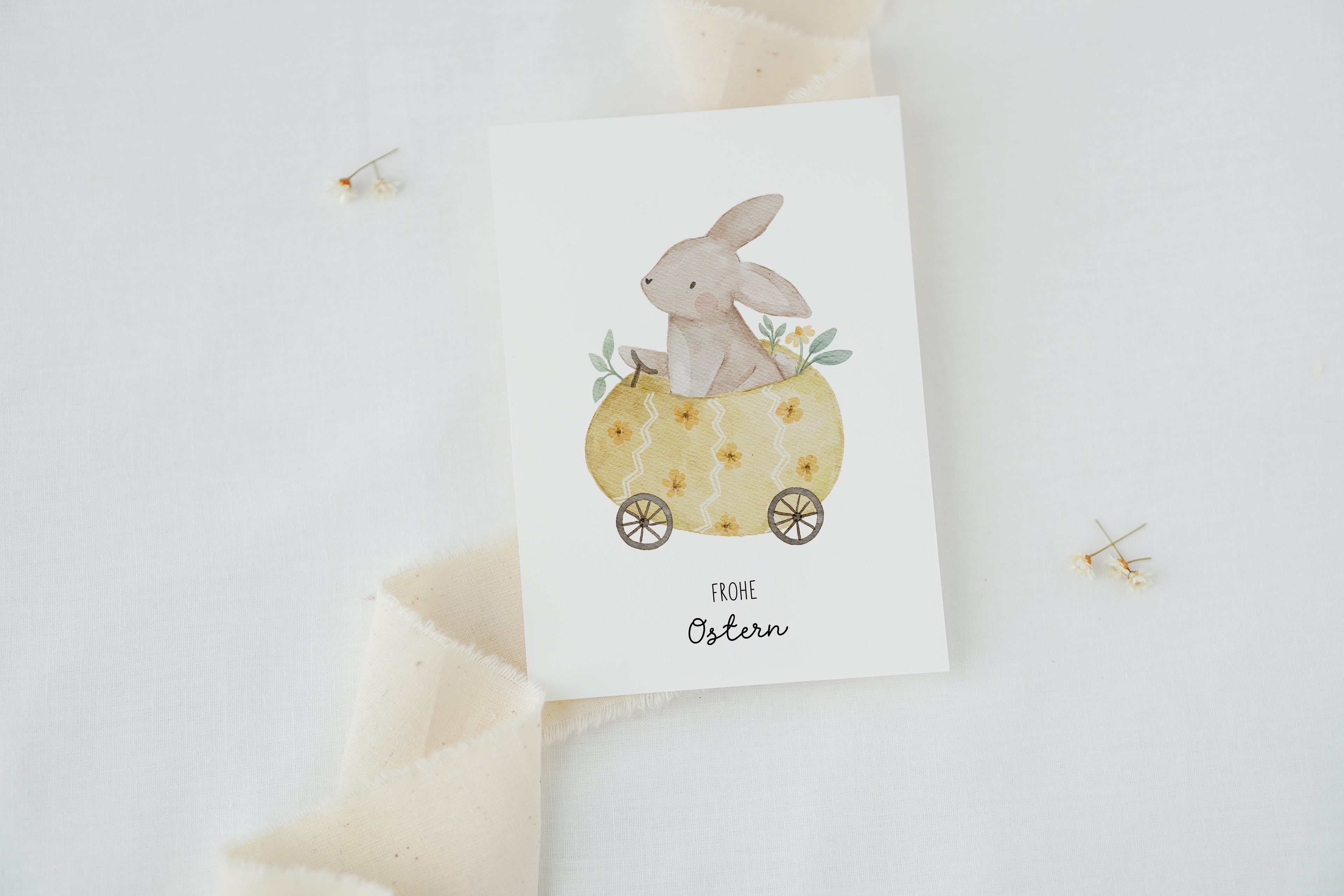 Osterkarte Hase im Osterei-Auto