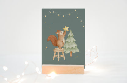 Weihnachtskarte Eichhörnchen mit Tannenbaum / Türkisgrün
