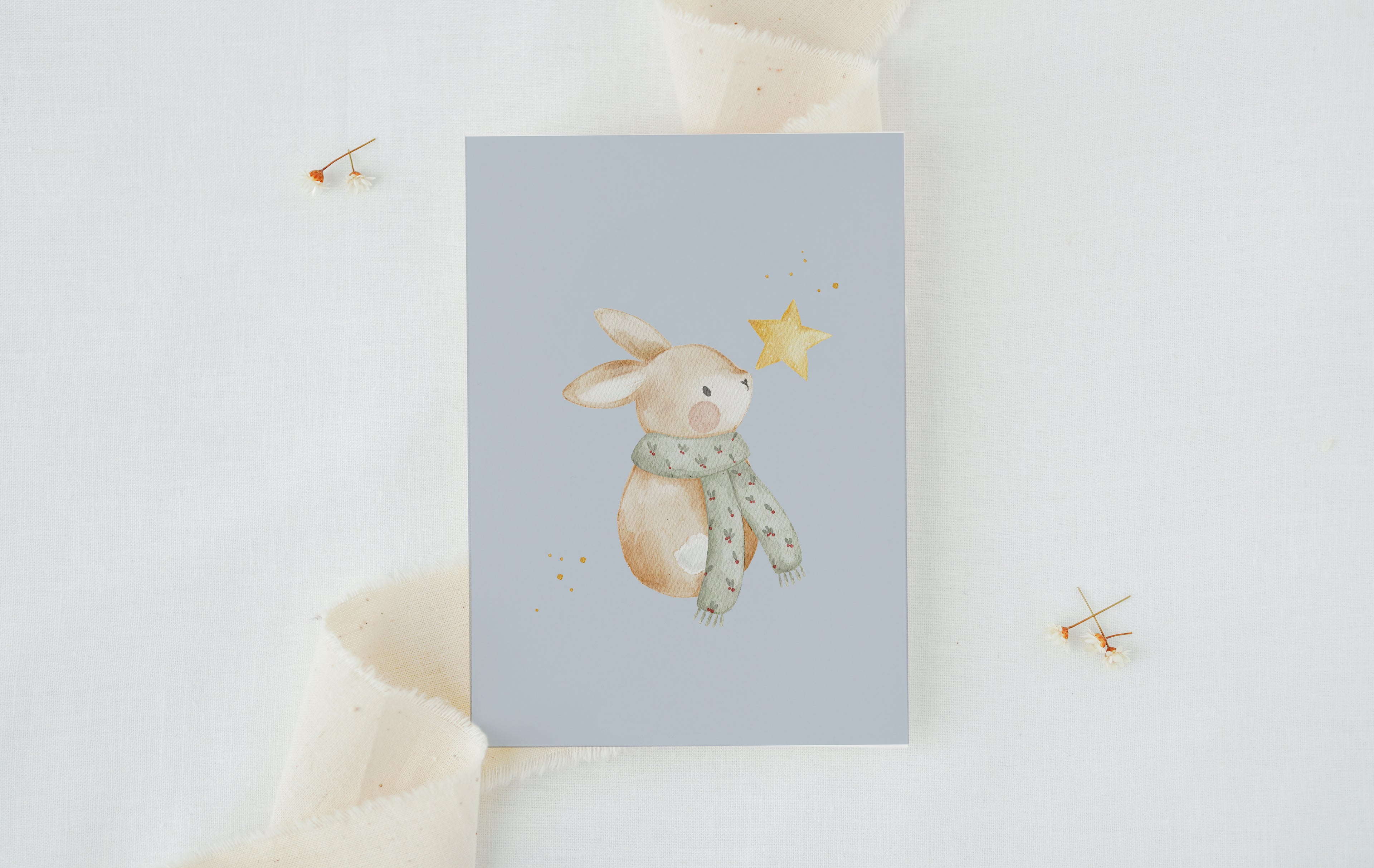 Weihnachtskarte Hase mit Stern / Hellblau