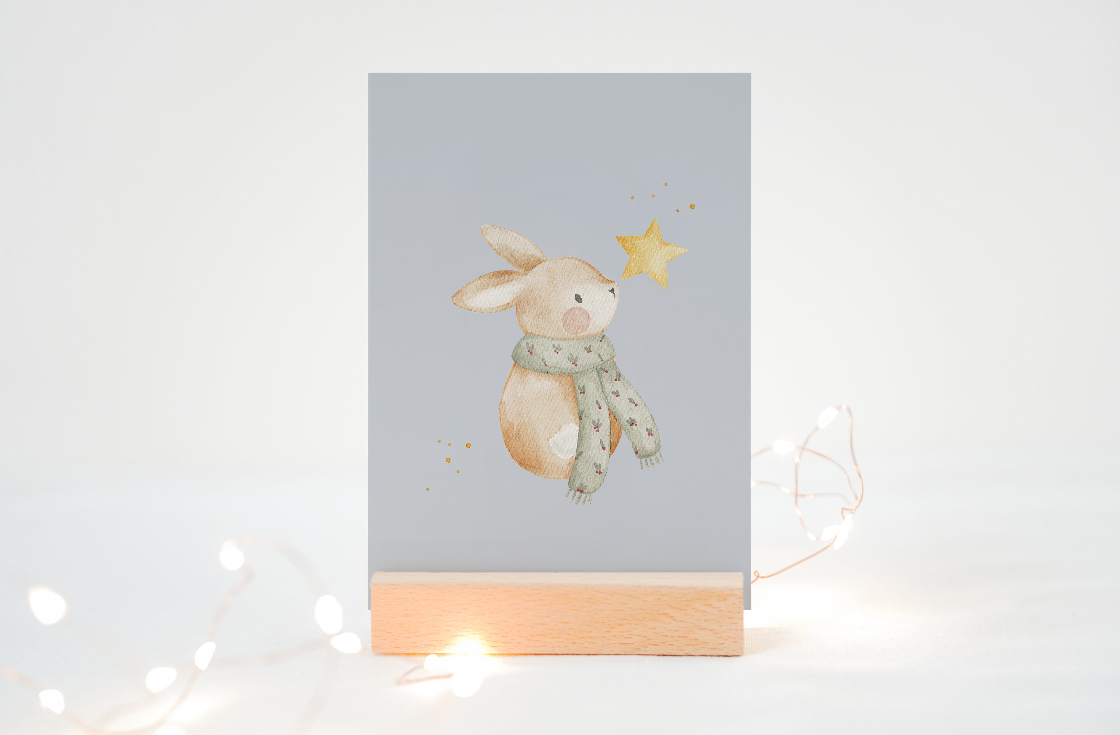 Weihnachtskarte Hase mit Stern / Hellblau